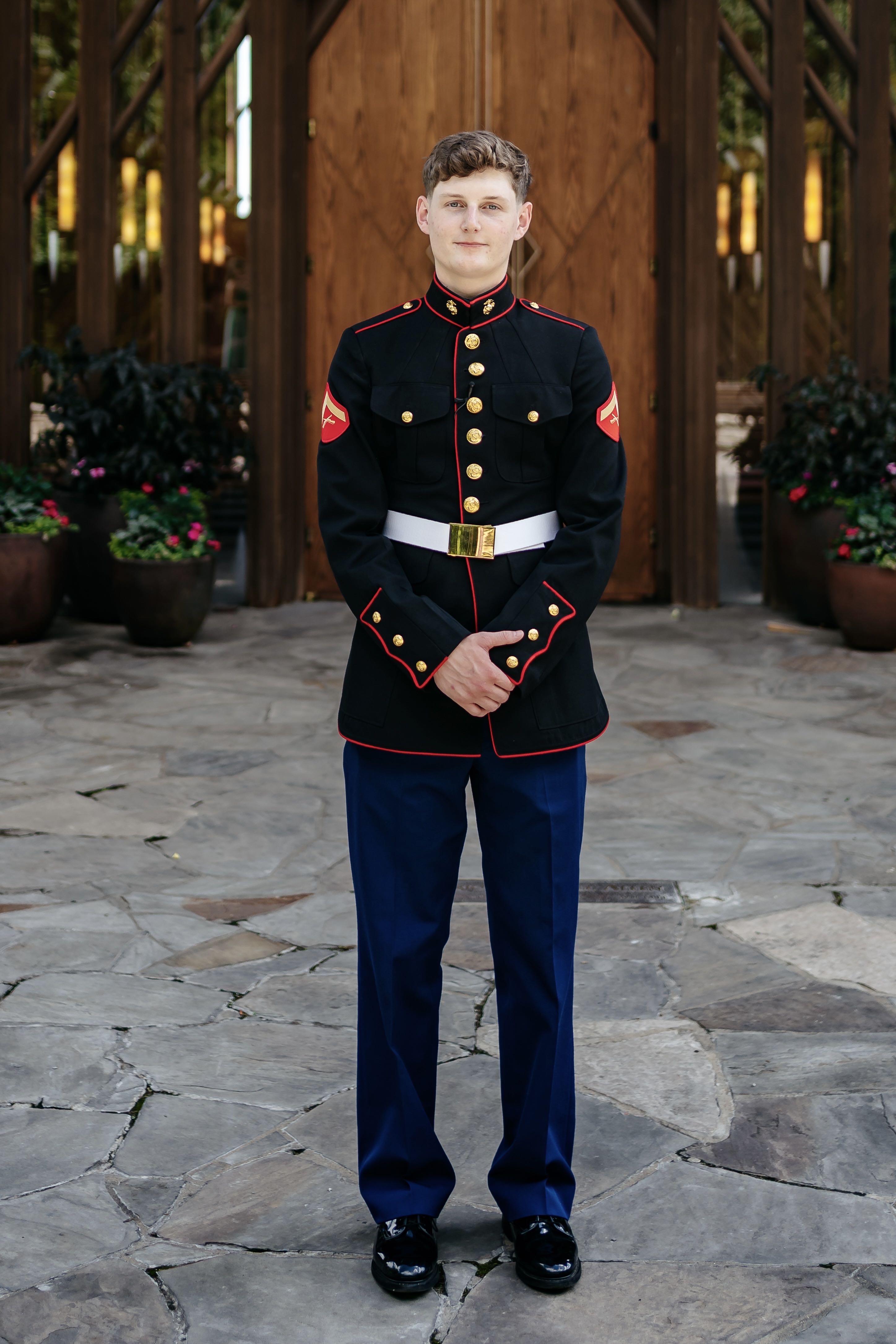 Parker Albrecht standing in his formal military uniform.